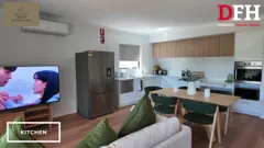 Living room and kitchen in the shared open-plan space